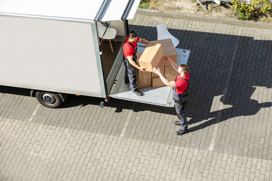 delivery people organize boxes