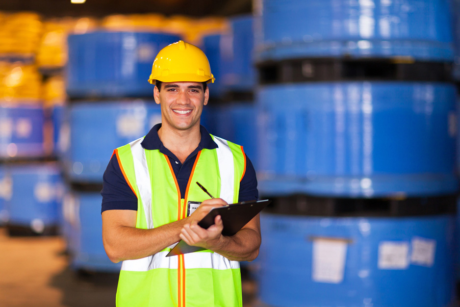worker in a warehouse recording stock