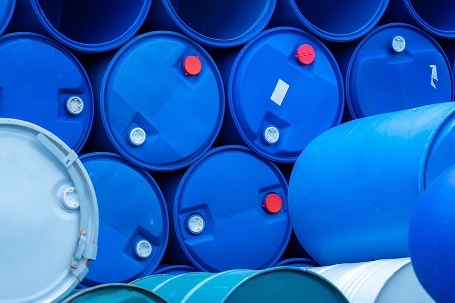 Empty blue chemical drums stack