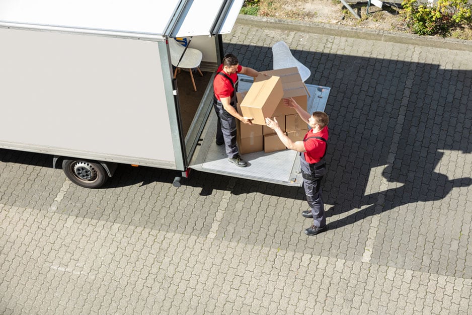 delivery people organize boxes