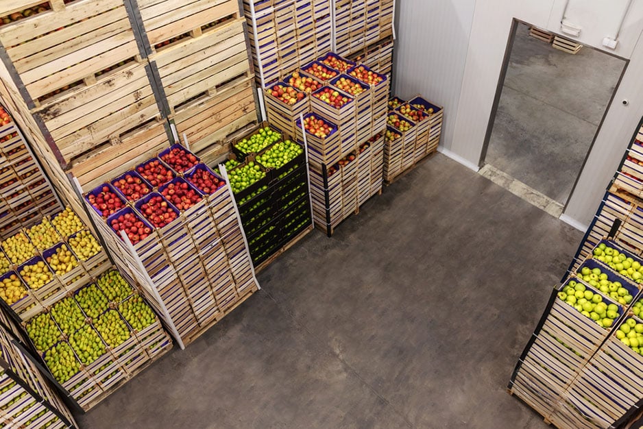 stacks food in refrigerated warehouse
