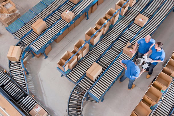 Top view of workers with papers and a digital tablet
