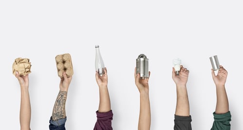 hands holding recyclable materials