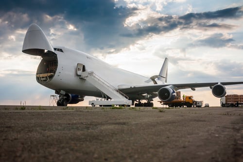 unloading wide body cargo plane