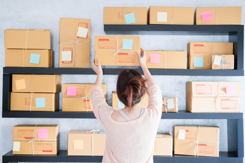 woman holding parcel box shelves