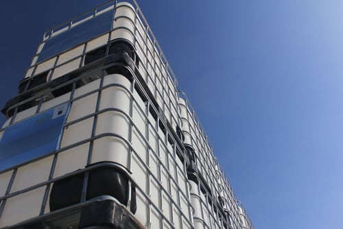 stacked ibcs under sky