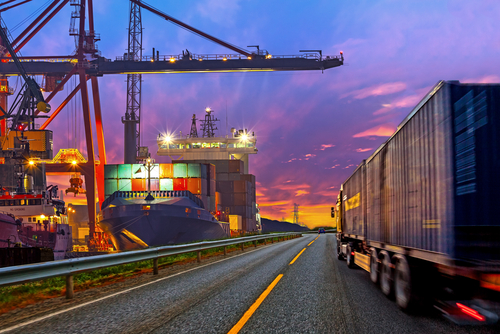 road near dock with shipping containers