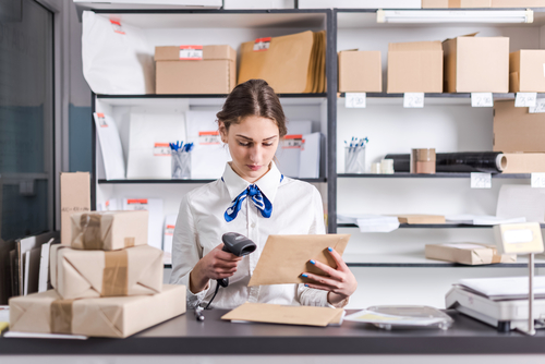 postal worker scanning envelope