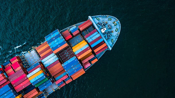 an aerial view of a cargo ship shipping freight containers