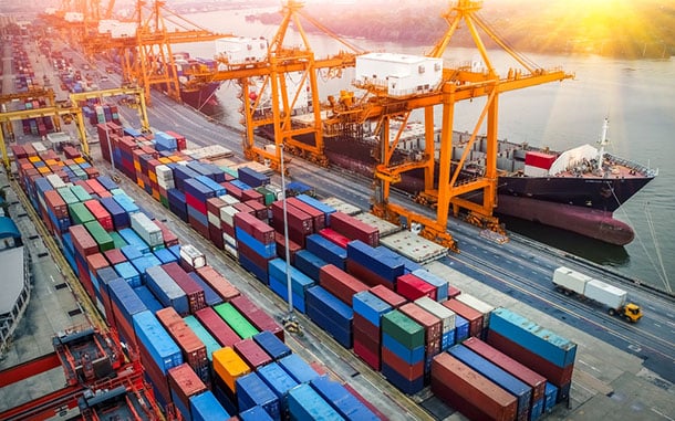 a crane bridge in a shipping yard